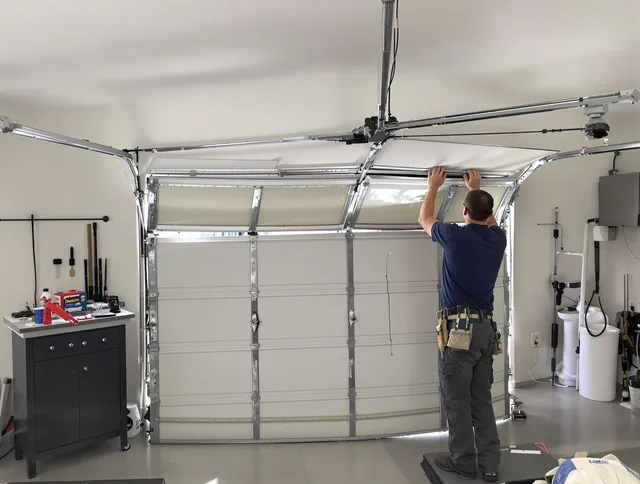South Whittier Garage Door Repair specialist performing precise section replacement on South Whittier garage door